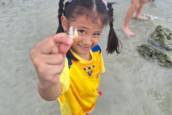 LIS grade 1 little girl holding a shell