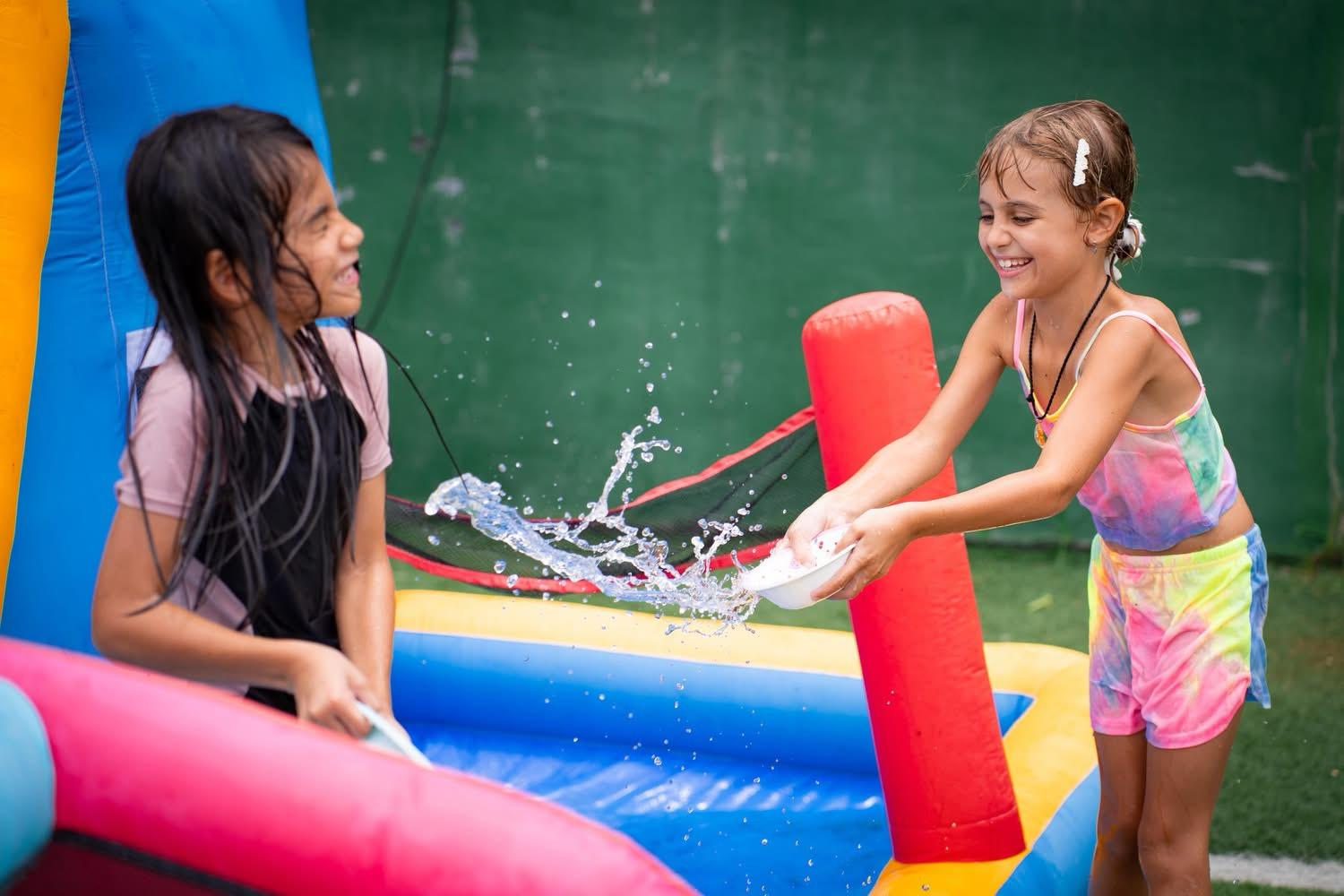 girls splashing water