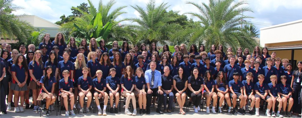 Secondary students with the school heads, management, and teachers