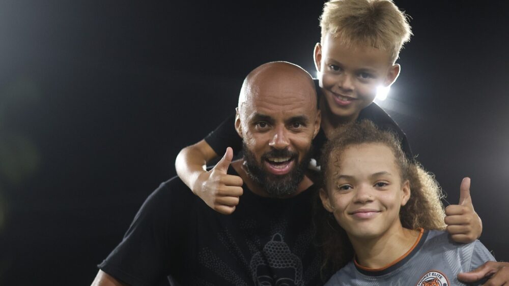 Coach with team players