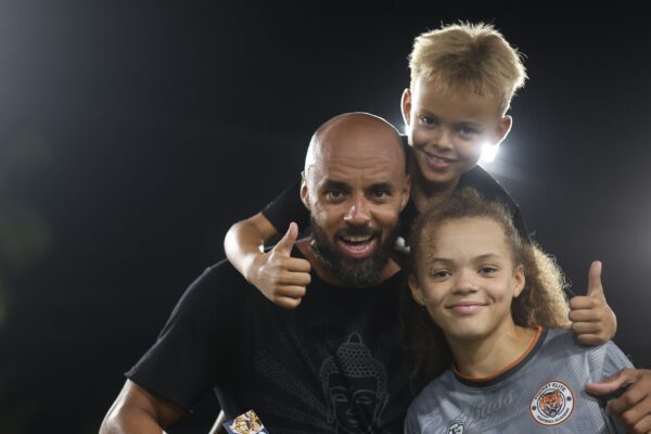 Coach with team players