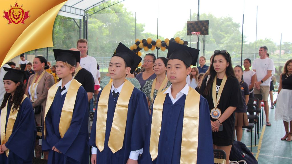 Graduates standing up for the program