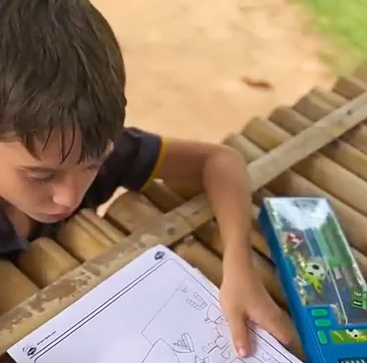 Lighthouse student drawing a map of Lighthouse campus