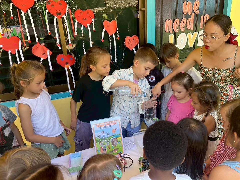 Teacher supervising students for a science activity