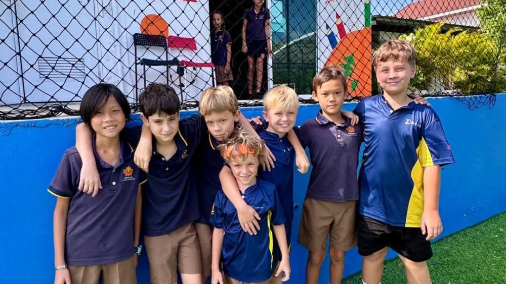 Boys smiling at the football pitch