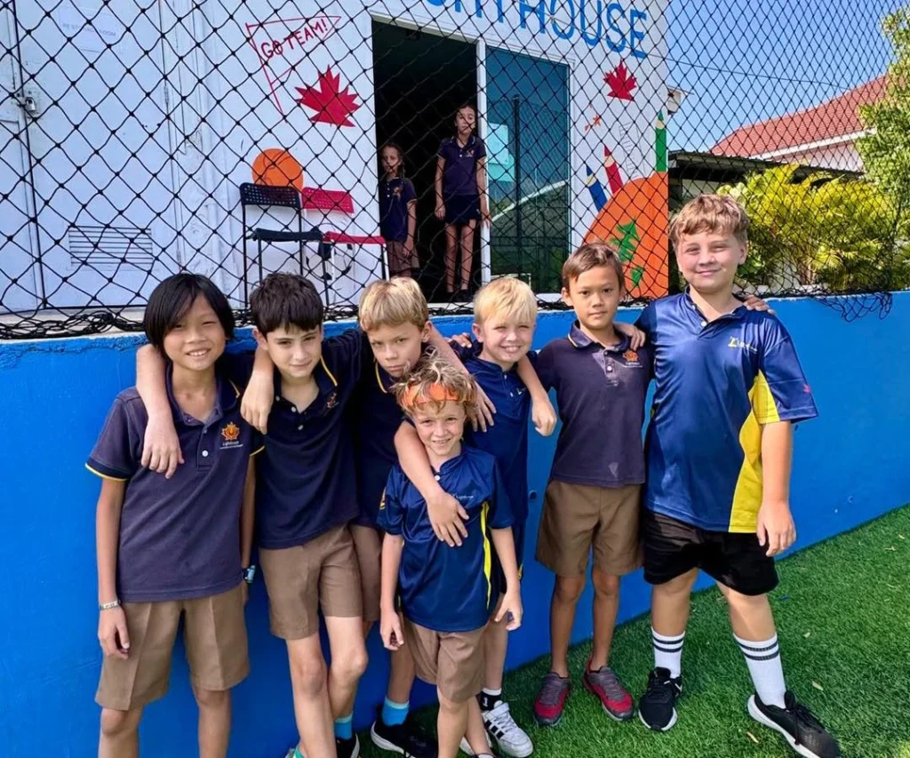 Boys smiling at the football pitch