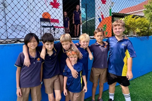 Boys smiling at the football pitch