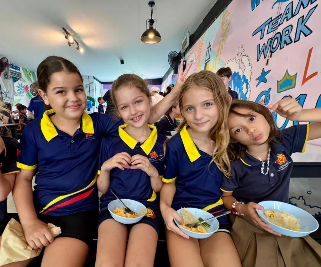 Girls smiling while eating snacks