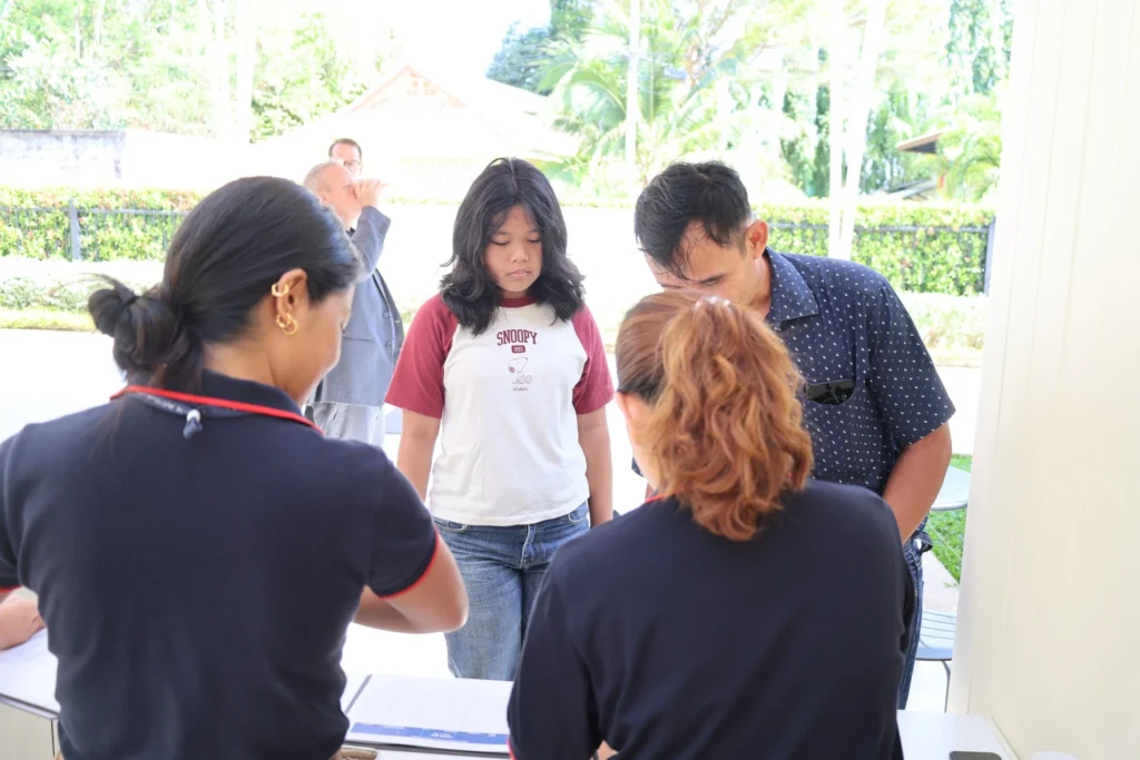 Parent and kid signing up for Open Day