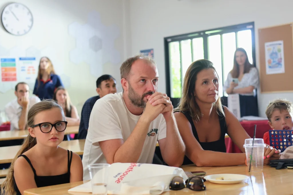 Parents and kids listening to the Open Day speech