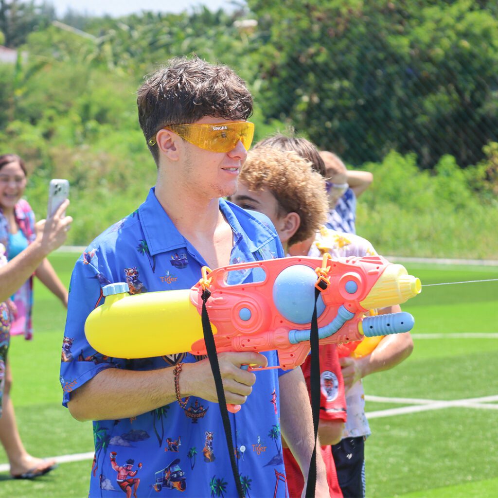Youth holding waterguns