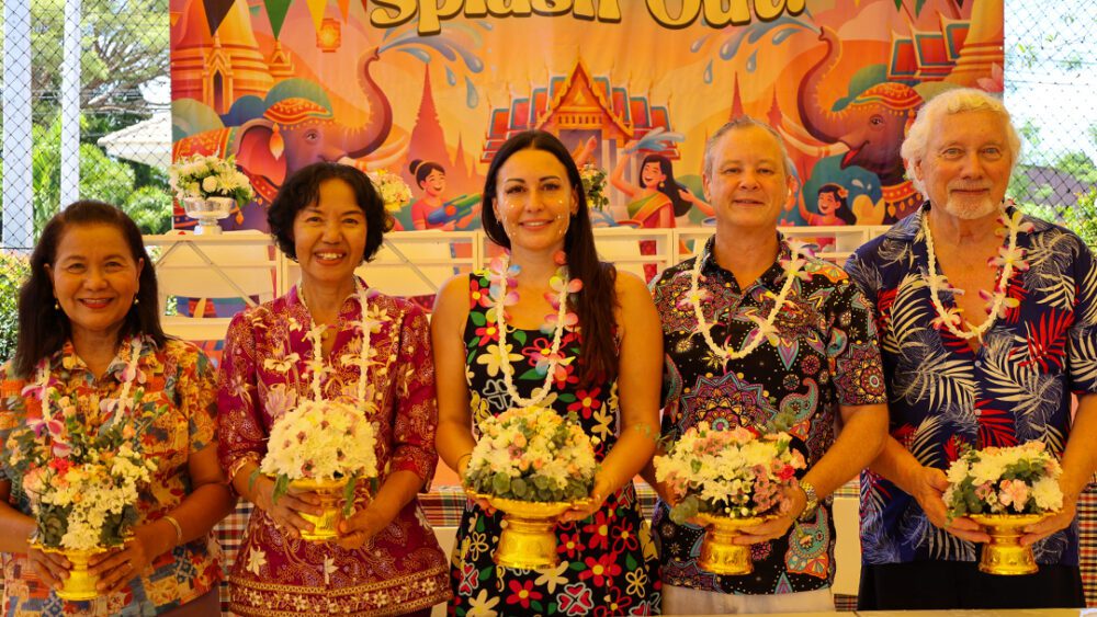 School heads holding flowers