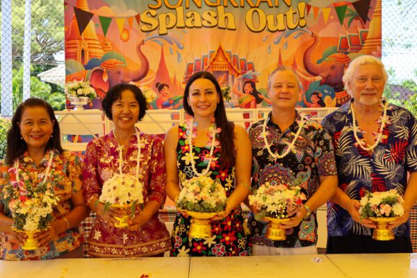 School heads holding flowers