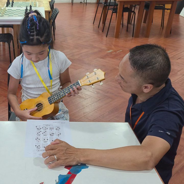 primary-camp-learning-musical-instrument