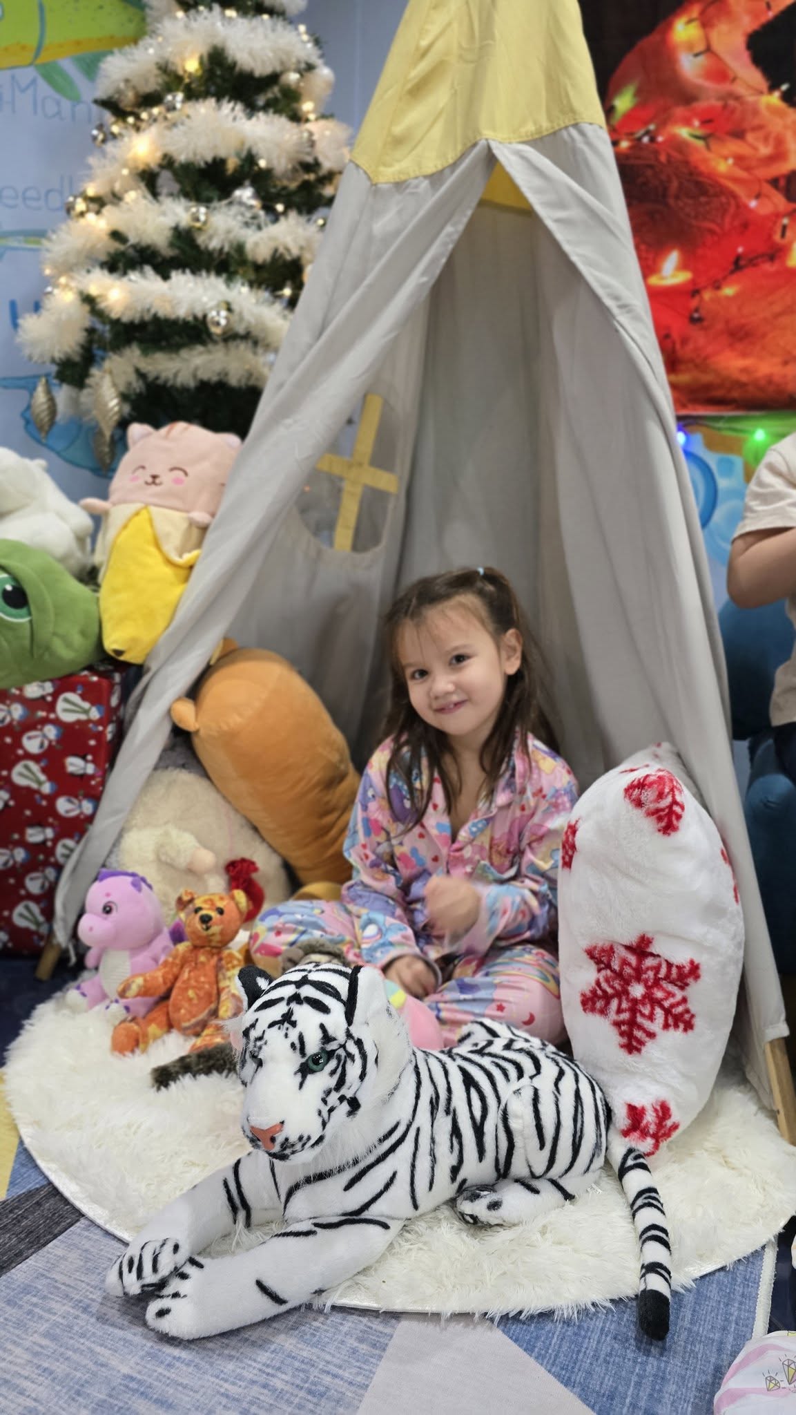 Child in pajama party setup