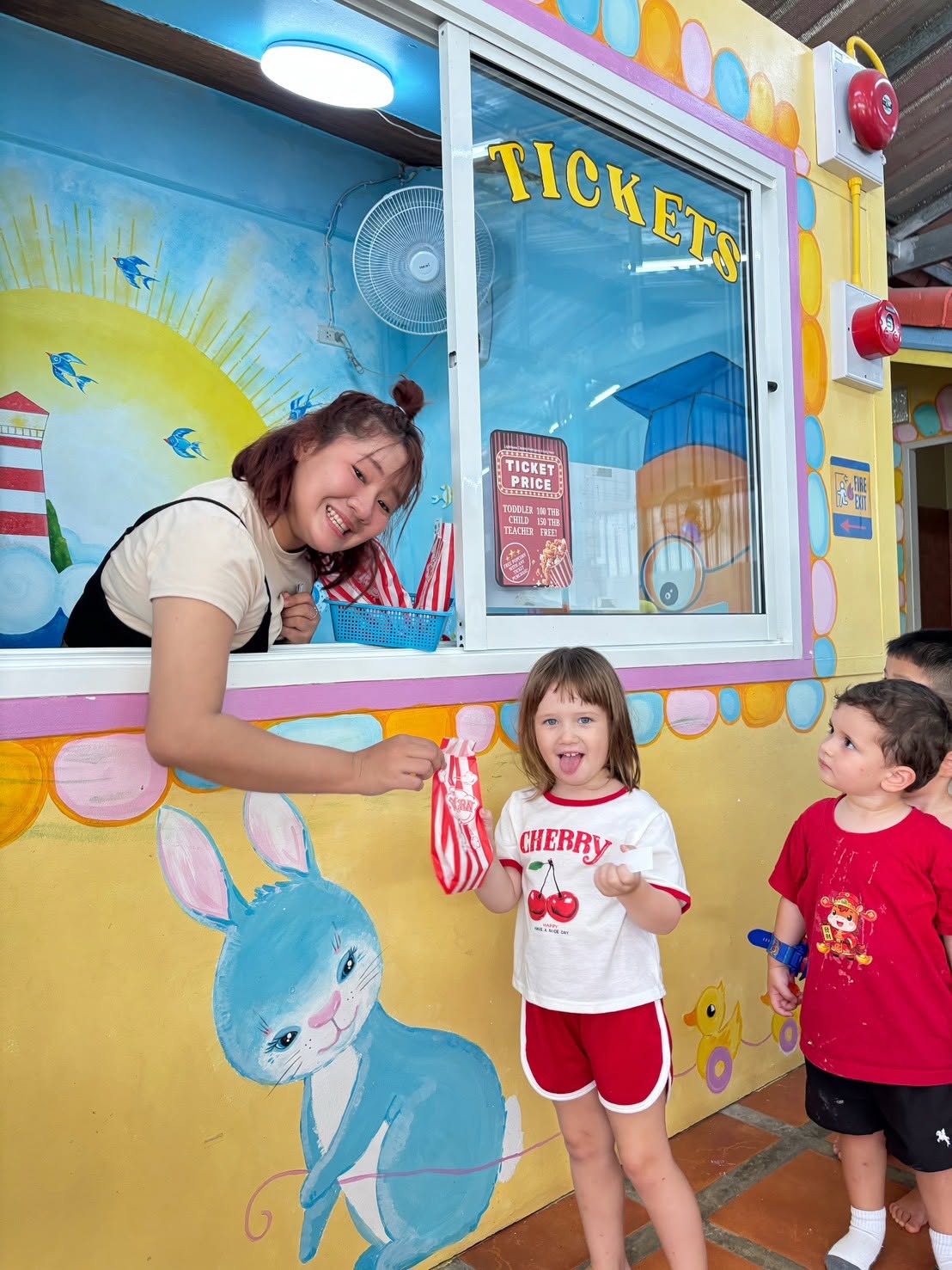 Children queueing up for tickets and popcorns