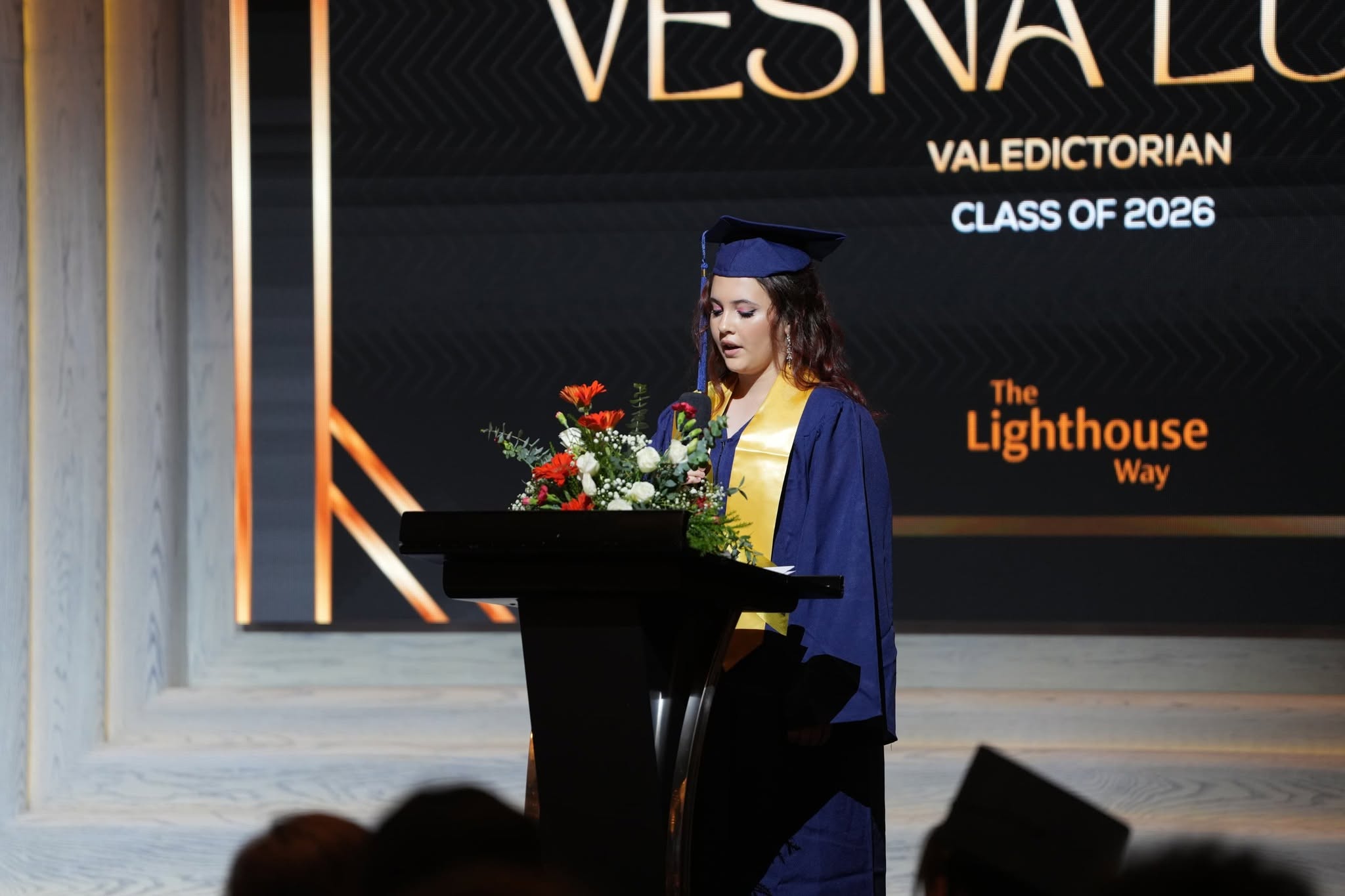 LIS Graduate giving a speech