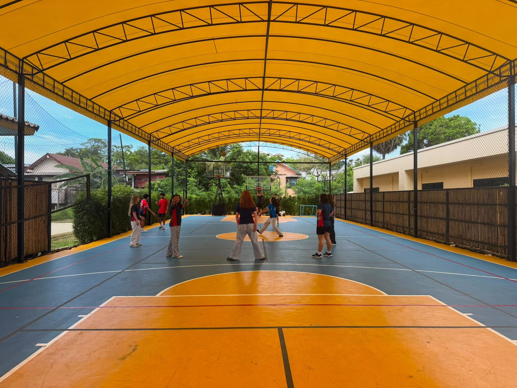 Lighthouse International School Students playing in the school covered court
