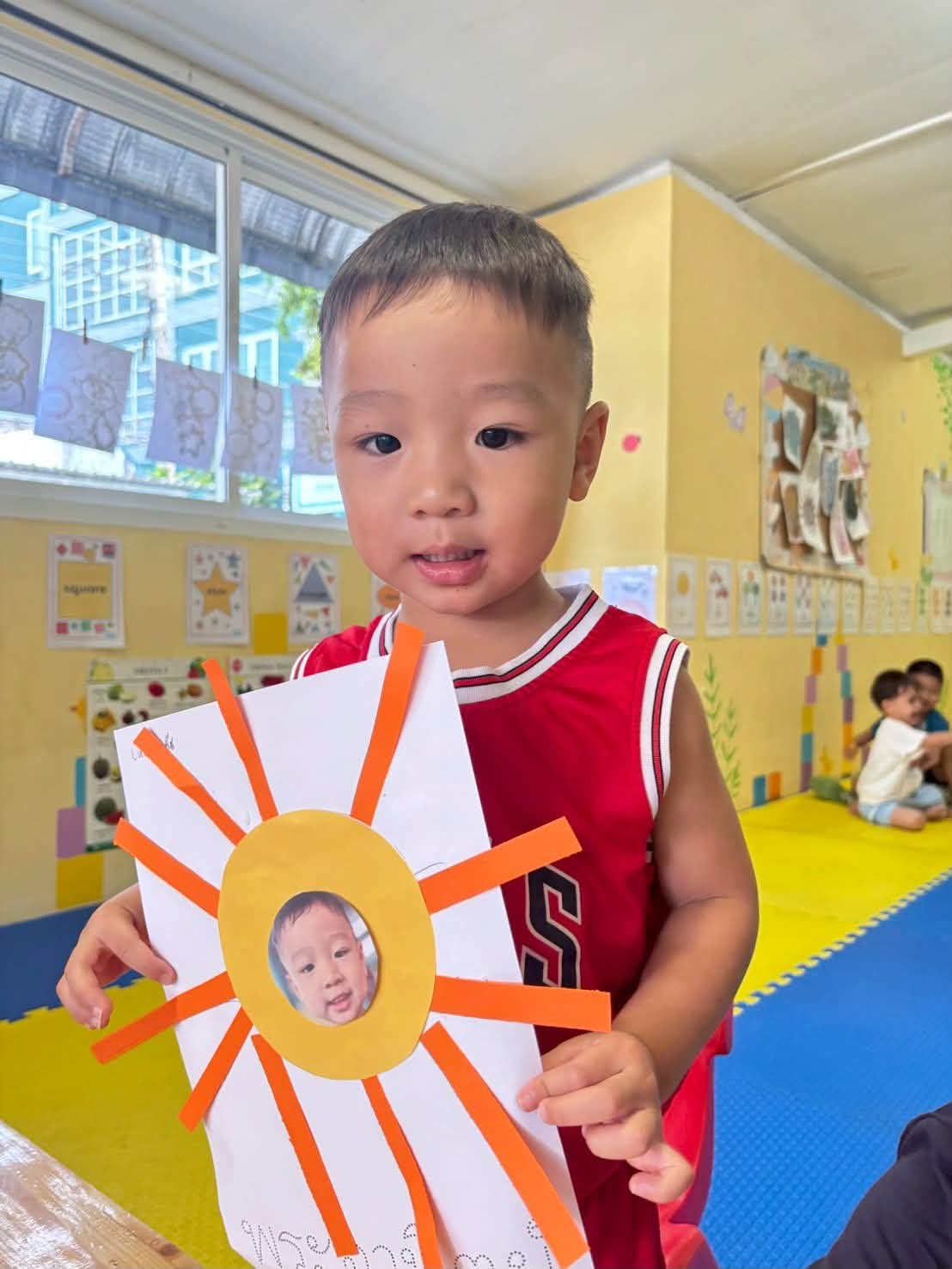 Boy holding his activity for Kindergarten summer school - Lighthouse Chalong