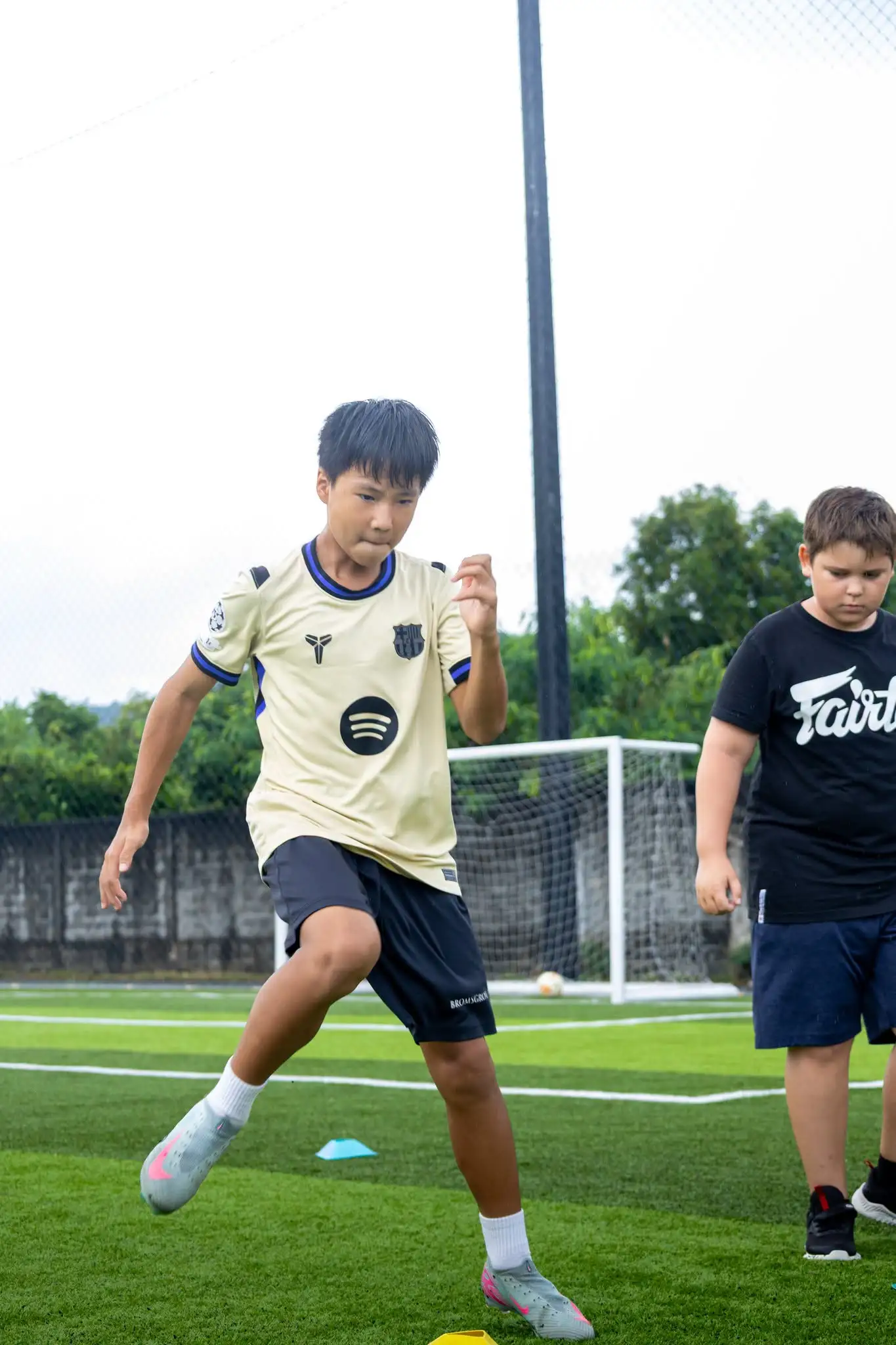 Boy kicking the ball - Football Summer Camp