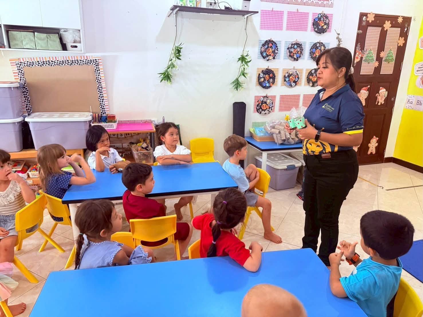 Kindergarten students listening to their teacher