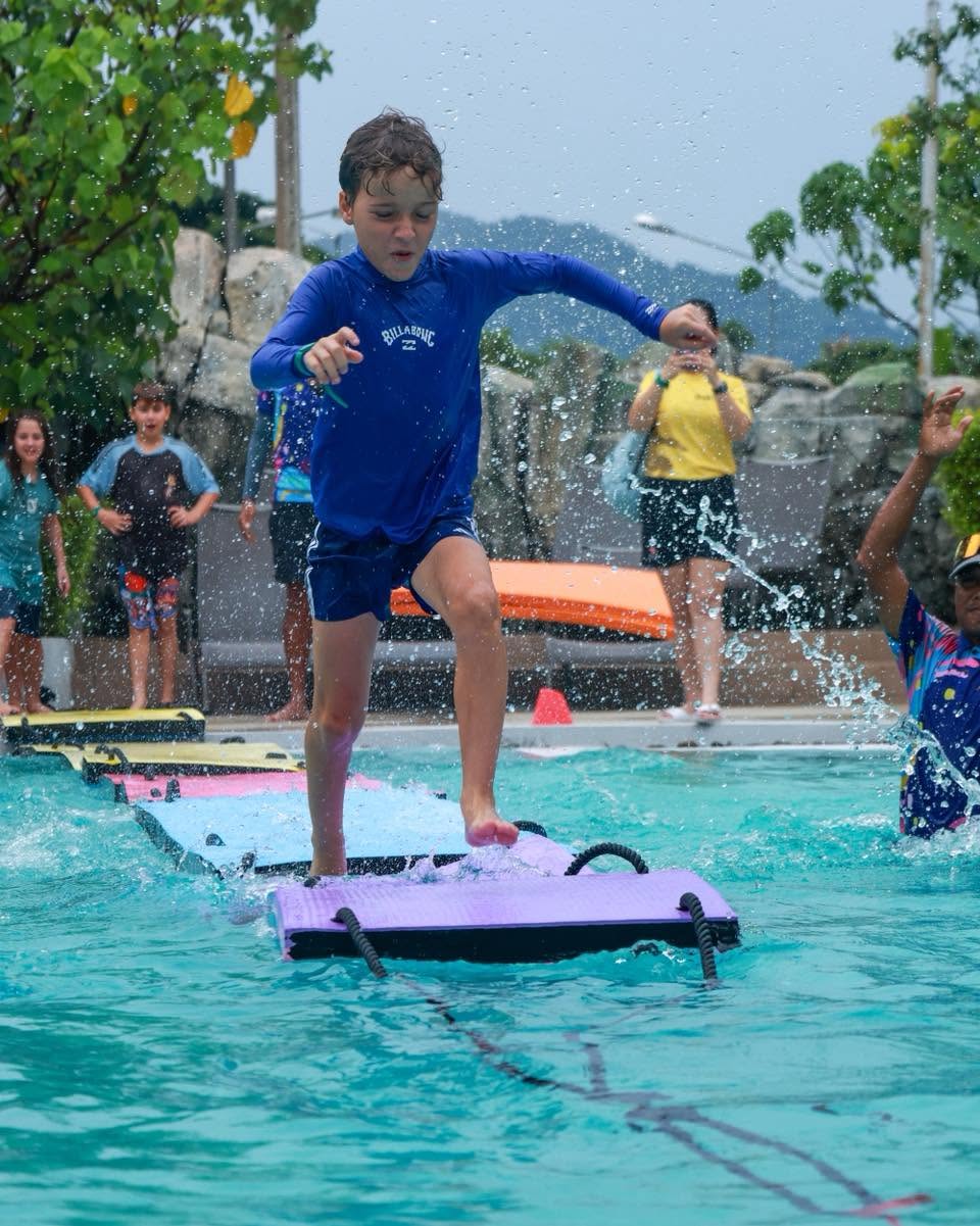 Lighthouse International School student running towards the pool Lighthouse International School student running towards the pool