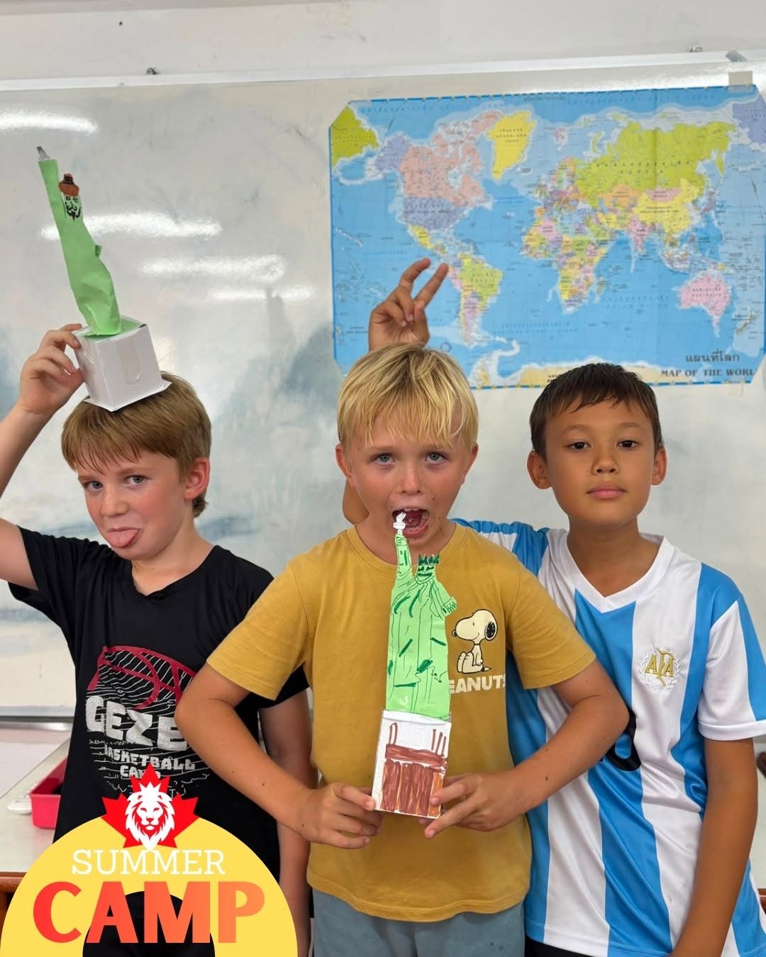 Three boys posting for a photo for Primary Summer Camp at Lighthouse International School