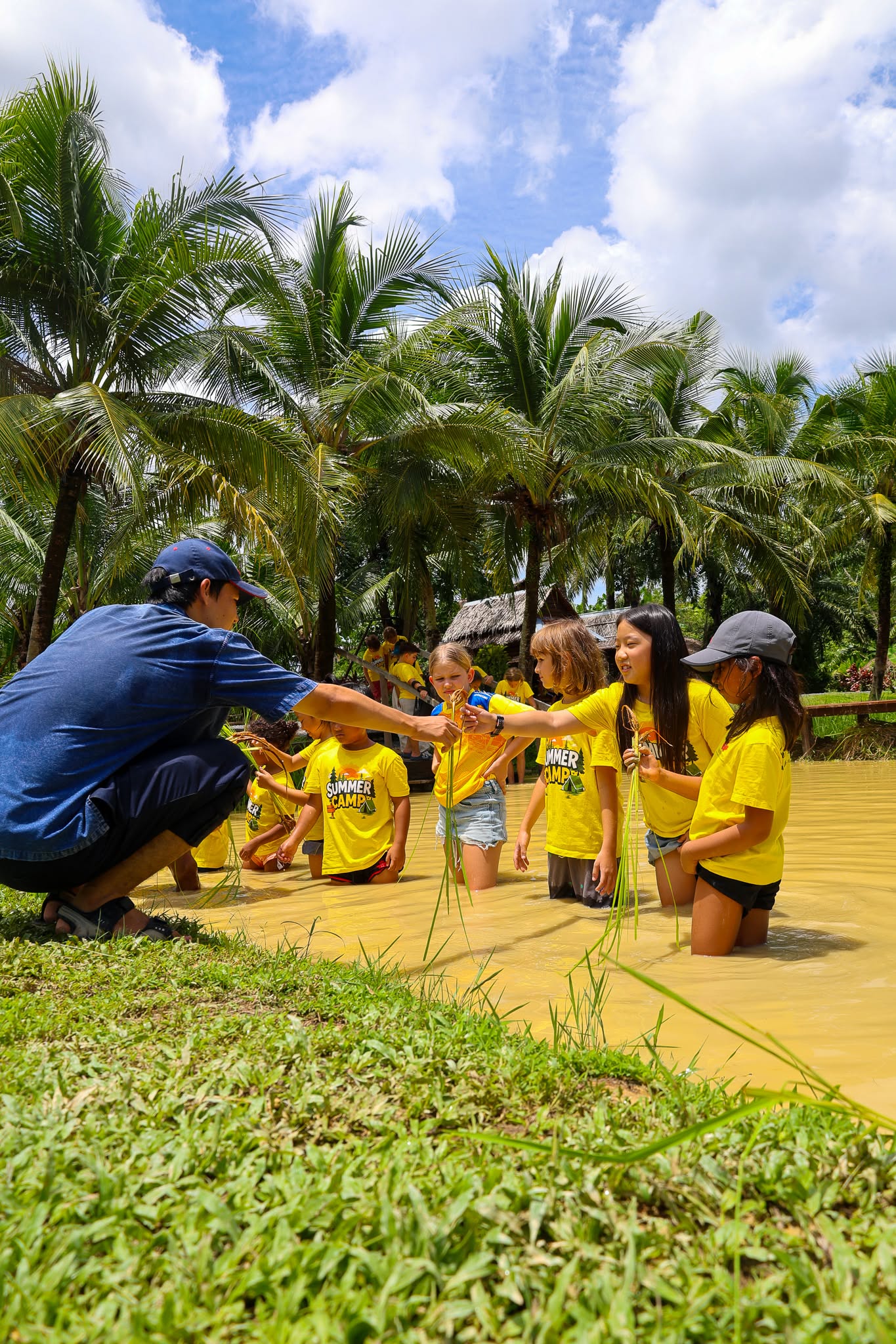 Farmer teaching Lighthouse Phuket students to farm 2