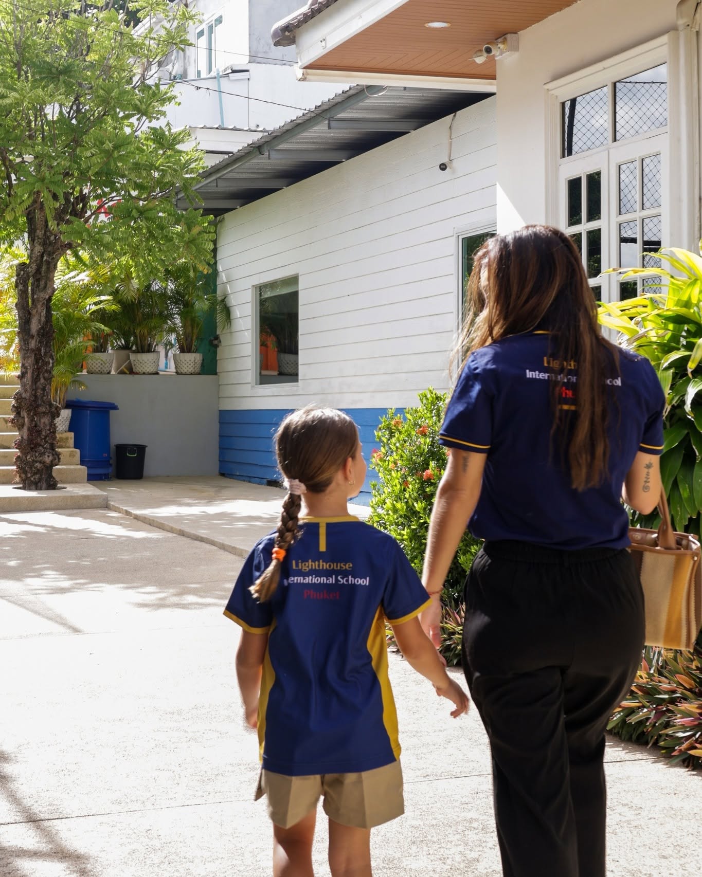 Teacher with student during first day of school