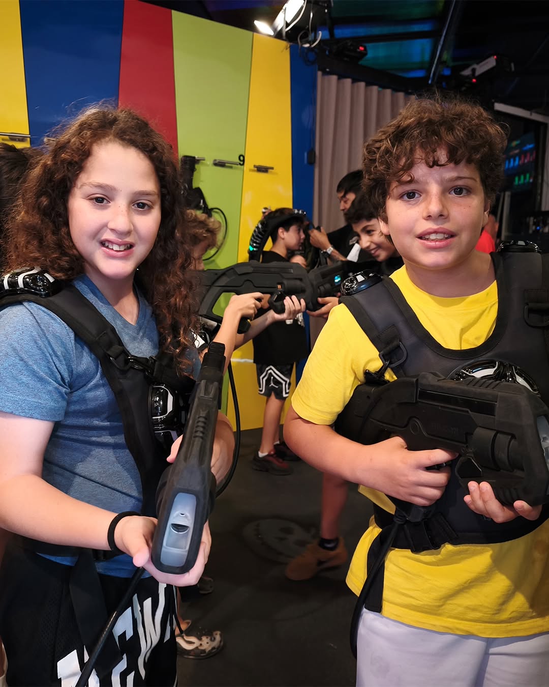 Two kids posing laser tag