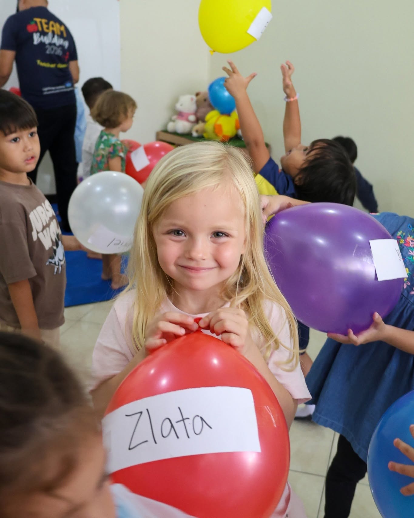 Kindergarteners smiling with balloon - Lighthouse International School Kindergarteners smiling with balloon - Lighthouse International School