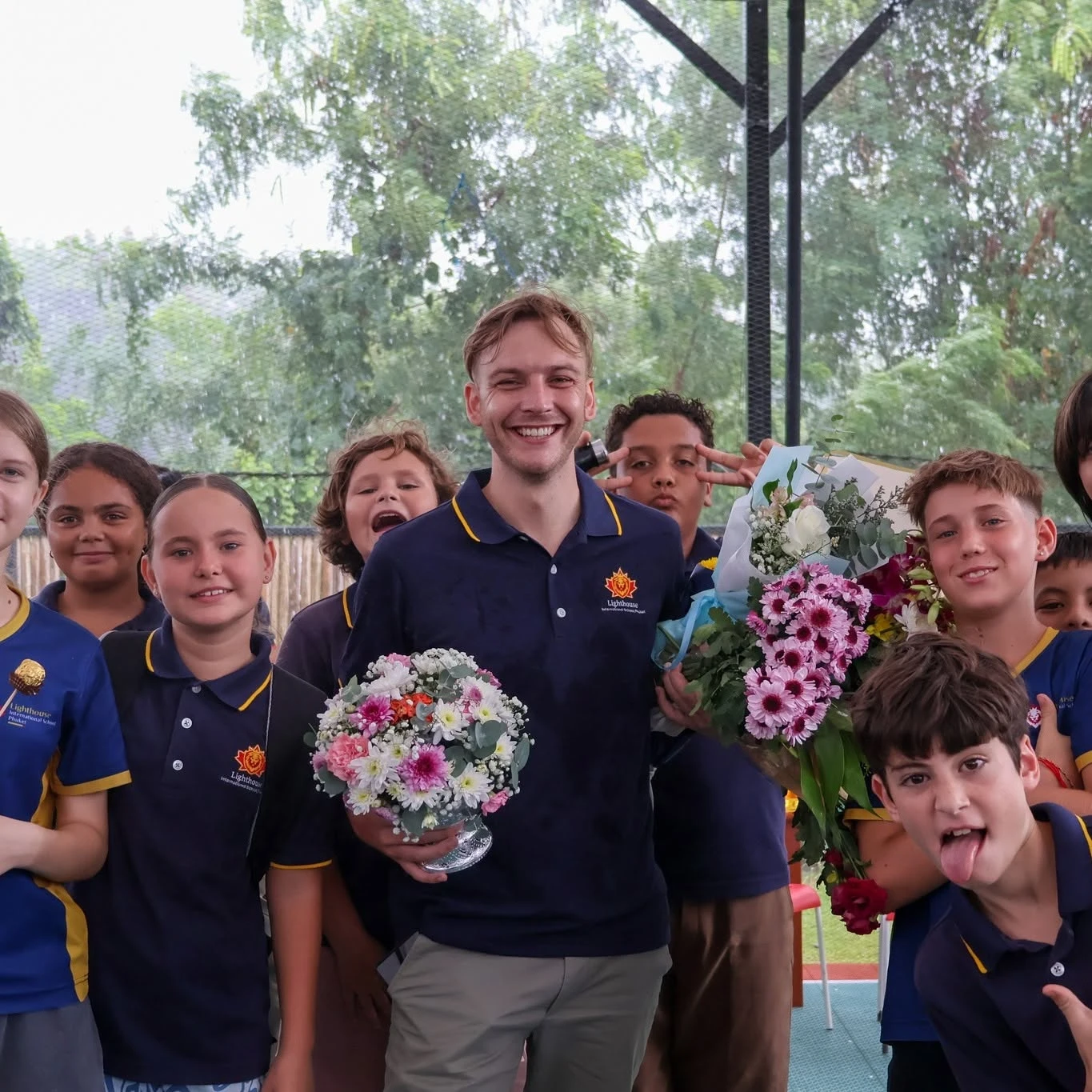 Lighthouse teacher beaming with students for Wai Kru Day