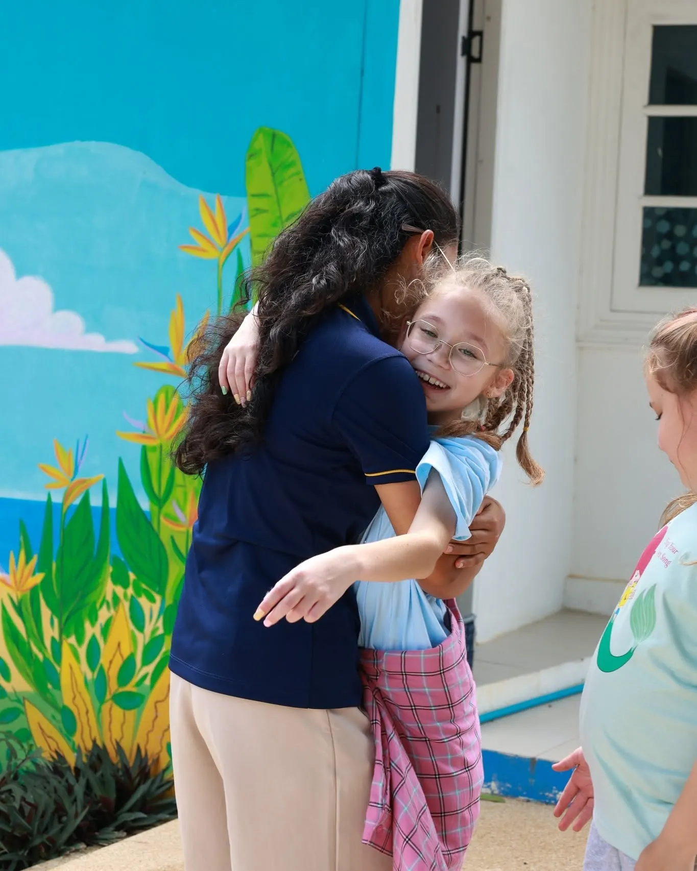 Teacher hugging student during World Peace Day at Lighthouse International School Teacher hugging student during World Peace Day at Lighthouse International School