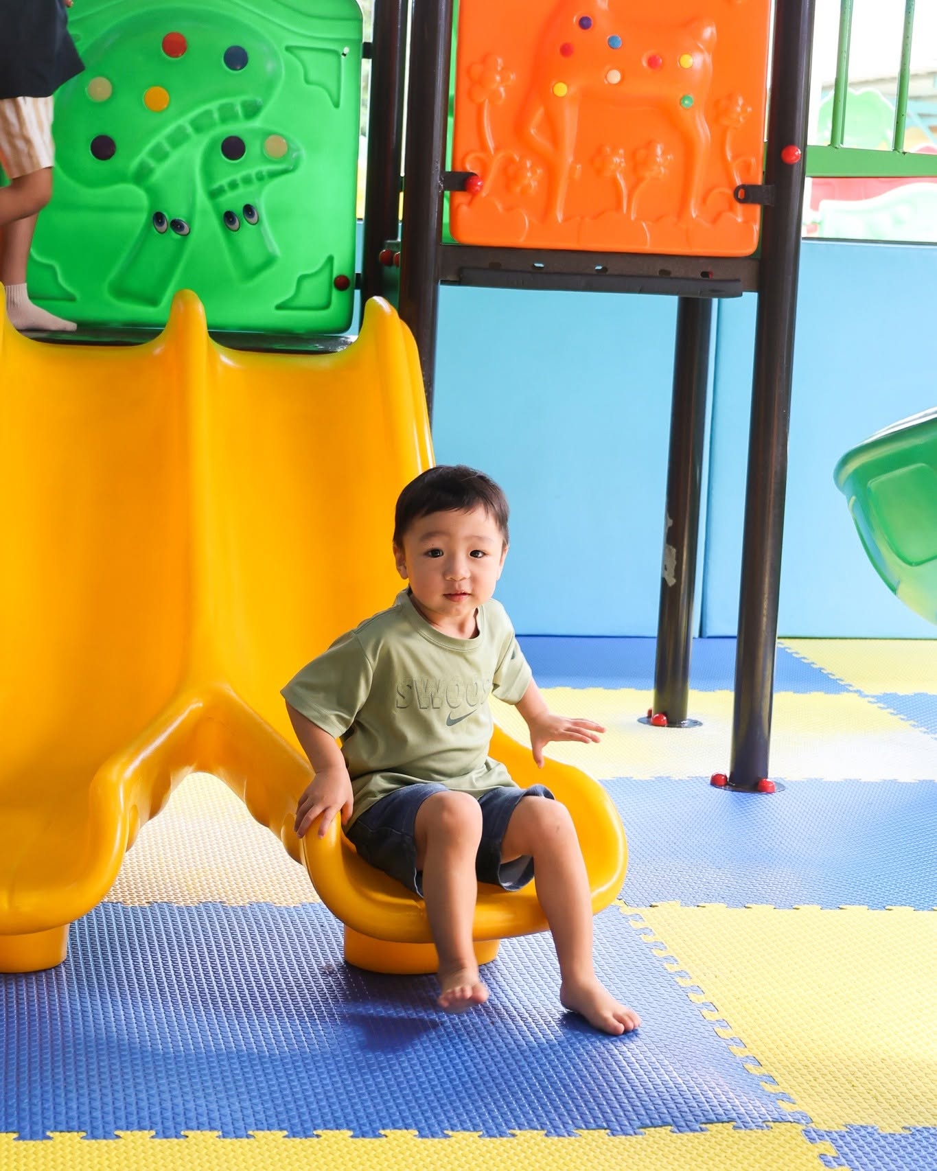 Young boy on the slide - Lighthouse International School Young boy on the slide - Lighthouse International School