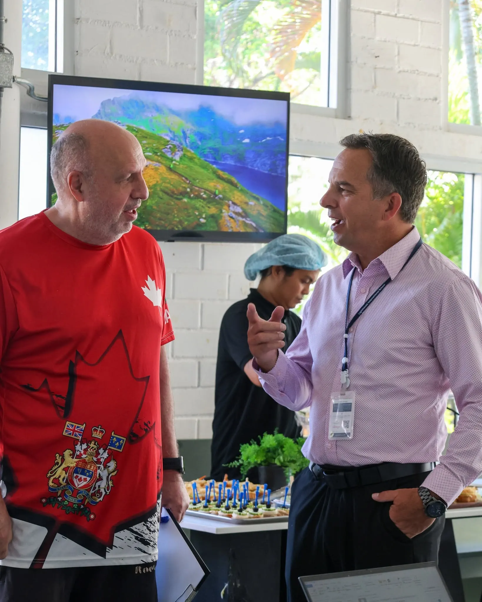 A school leader chatting directly with a parent at the Lighthouse International School Coffee Time.